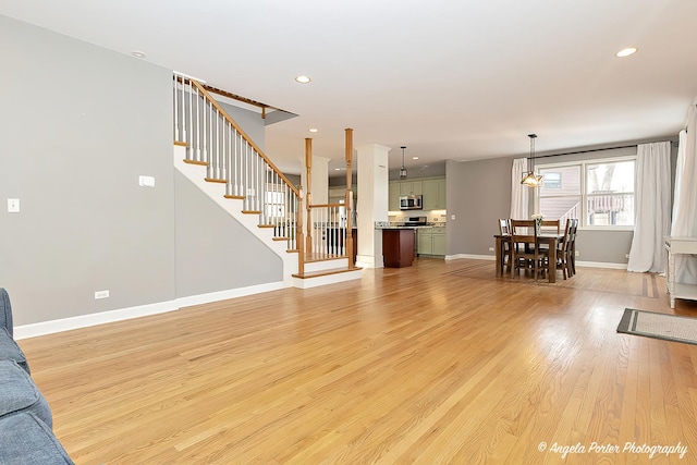 unfurnished living room featuring light wood-type flooring