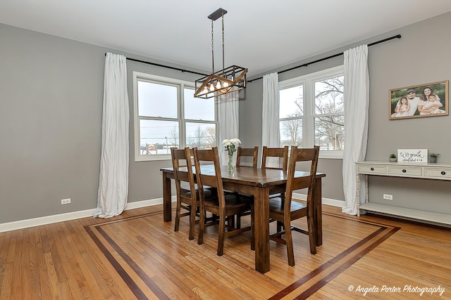 dining space with light hardwood / wood-style floors