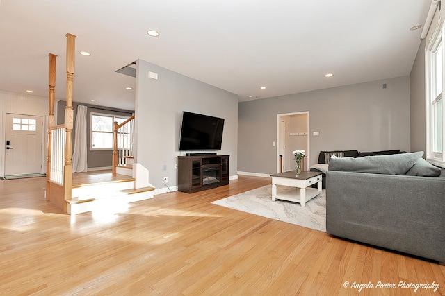 living room with light hardwood / wood-style flooring