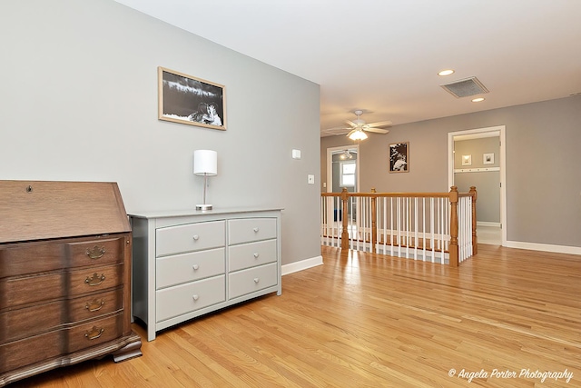 interior space featuring light hardwood / wood-style floors and ceiling fan