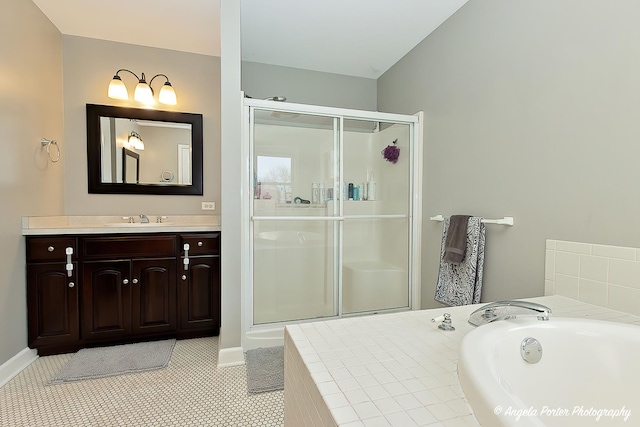 bathroom with independent shower and bath, tile patterned flooring, and vanity