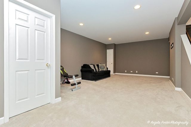 living area with light carpet