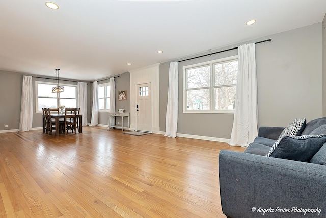 living room with light hardwood / wood-style flooring