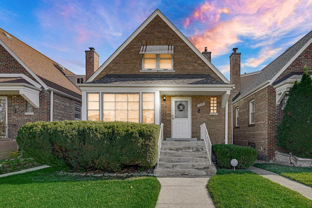 view of front of house with a lawn