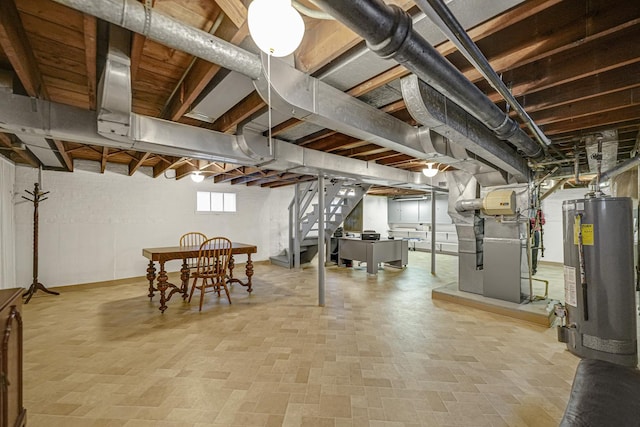 basement featuring gas water heater and heating unit