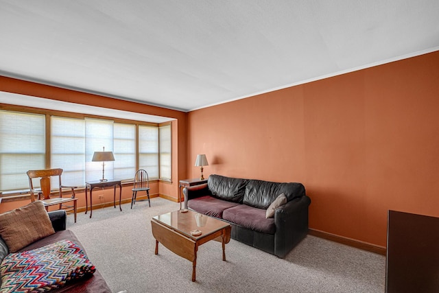 carpeted living room featuring crown molding