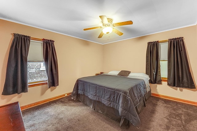 bedroom with ceiling fan, crown molding, and dark colored carpet