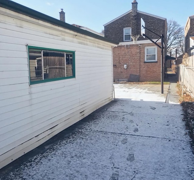 view of side of property featuring a patio area