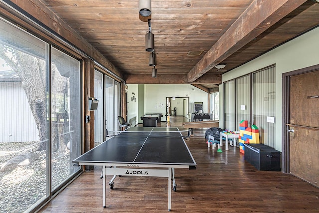 rec room featuring beam ceiling, hardwood / wood-style flooring, track lighting, and wooden ceiling