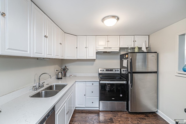 kitchen featuring white cabinetry, sink, dark wood-type flooring, and appliances with stainless steel finishes