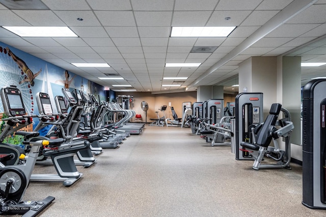 workout area featuring a drop ceiling