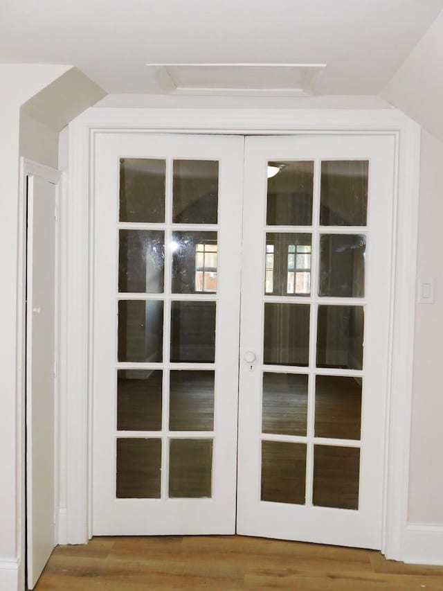 entryway featuring french doors and hardwood / wood-style flooring