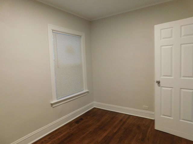 empty room with dark wood-type flooring