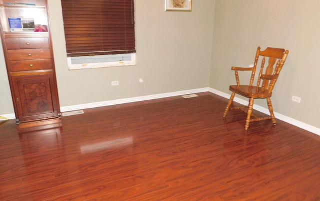 unfurnished room with dark hardwood / wood-style flooring