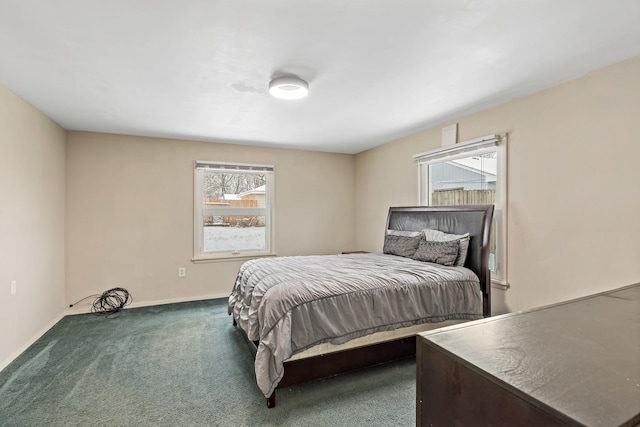 carpeted bedroom featuring multiple windows