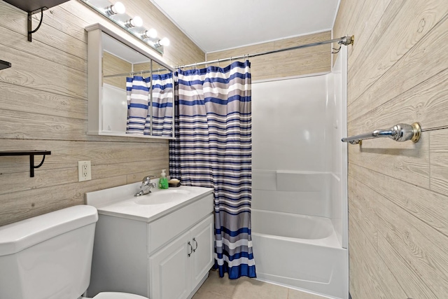 full bathroom with tile patterned floors, vanity, shower / bathtub combination with curtain, and wooden walls