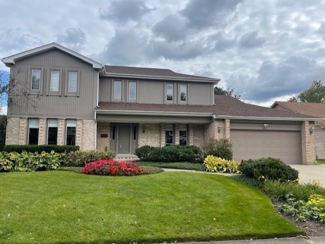 front facade featuring a garage and a front lawn