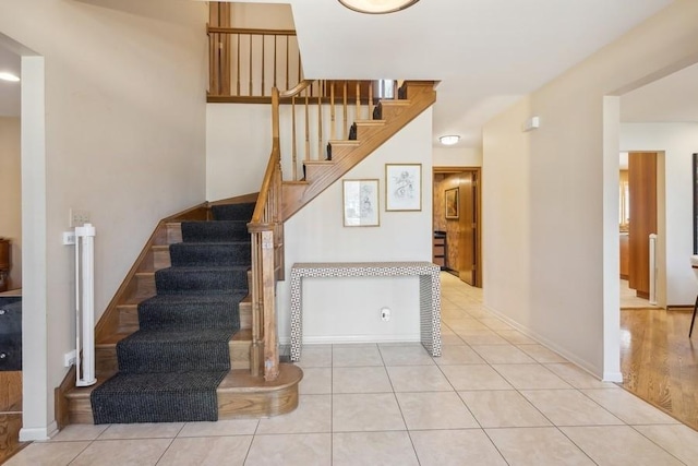 stairs with tile patterned flooring