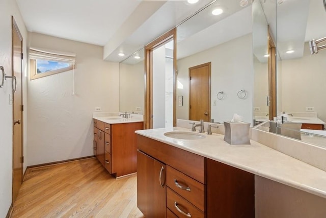 bathroom with vanity and hardwood / wood-style floors