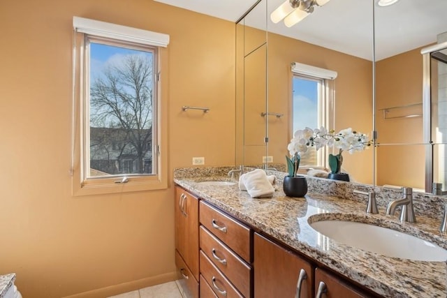 bathroom featuring tile patterned flooring and vanity