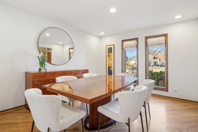 dining space with light hardwood / wood-style floors