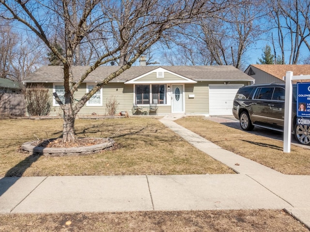 single story home featuring a garage, a chimney, a front yard, and roof with shingles