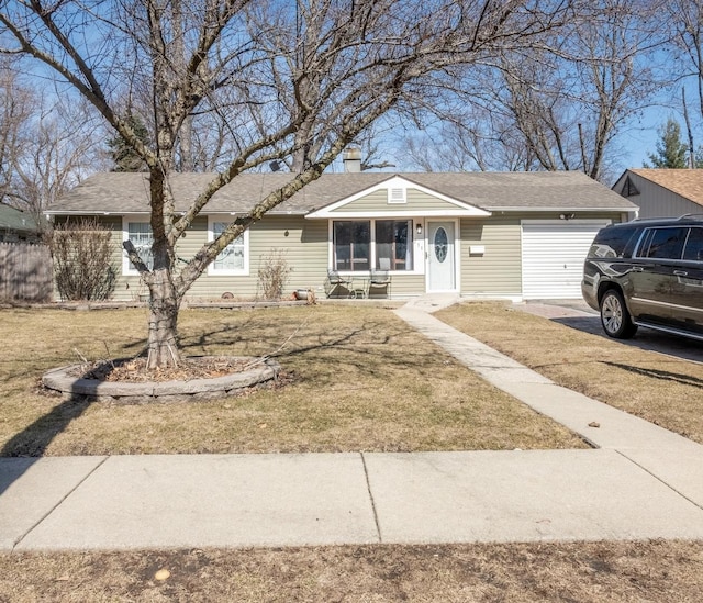 single story home featuring a front yard, a garage, driveway, and a shingled roof