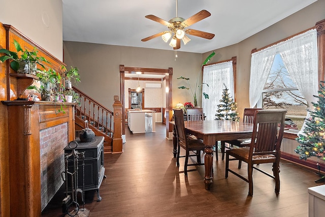 dining room featuring ceiling fan and dark hardwood / wood-style floors