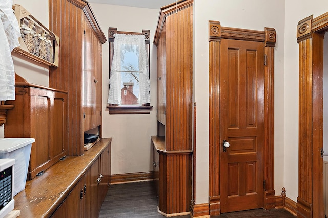 corridor with dark hardwood / wood-style floors