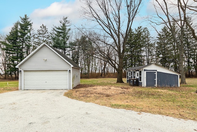 exterior space featuring a garage and an outdoor structure