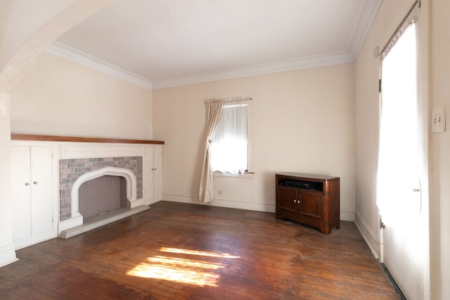 unfurnished living room with crown molding, dark hardwood / wood-style floors, and a fireplace