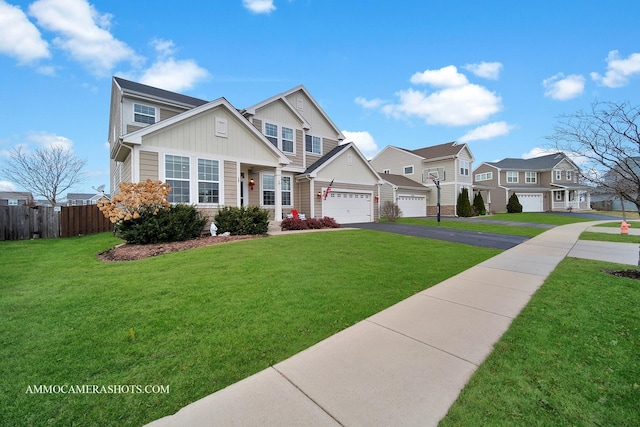 view of front of property featuring a garage and a front yard