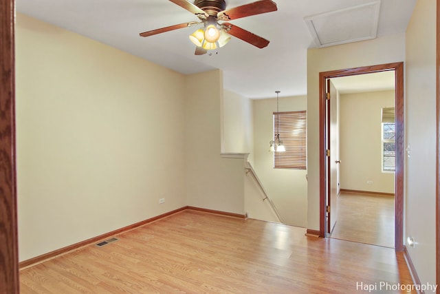 unfurnished room with ceiling fan and light hardwood / wood-style floors