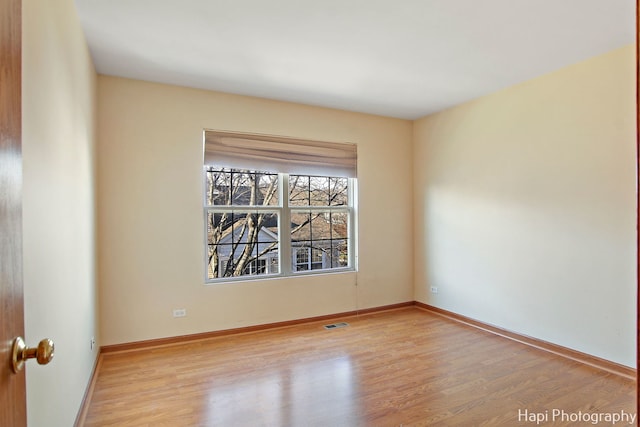 empty room with light wood-type flooring