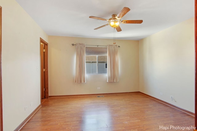 spare room featuring ceiling fan and light wood-type flooring