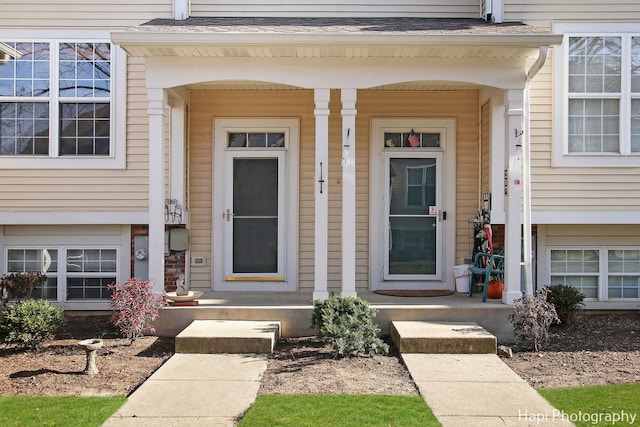 view of exterior entry featuring a porch