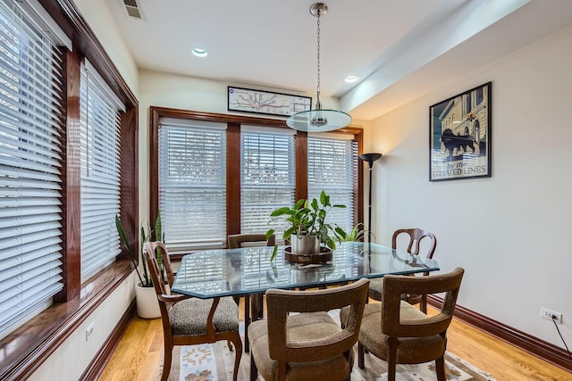 dining room with light wood-type flooring