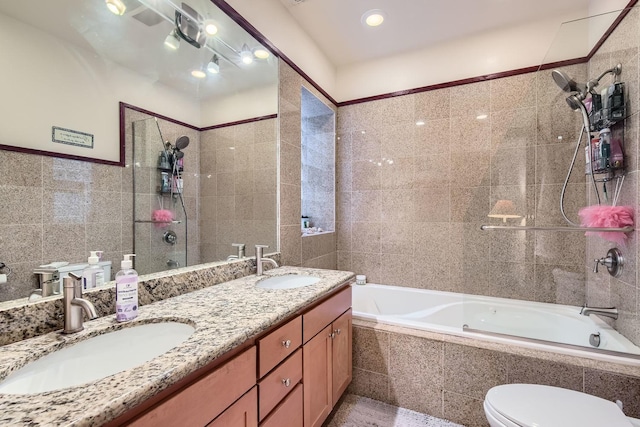 full bathroom featuring vanity, toilet, tile walls, and tiled shower / bath combo