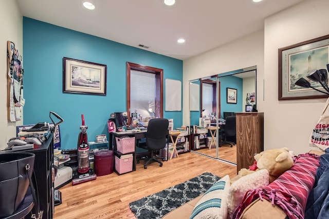 office space with light hardwood / wood-style floors