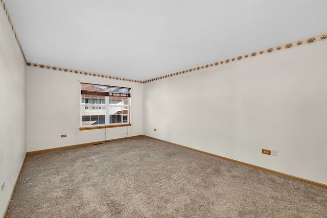 unfurnished room with carpet flooring