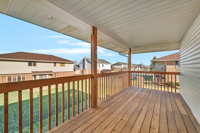 wooden terrace with a yard