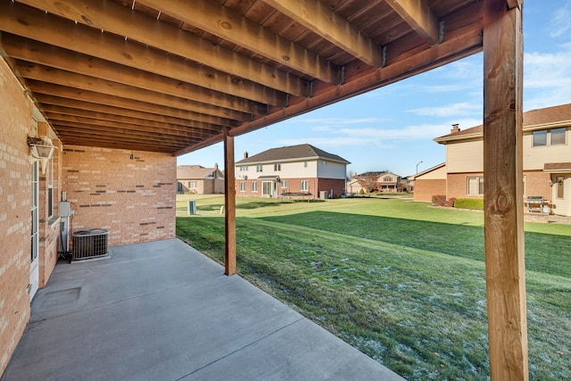 view of yard with a patio area and central AC unit