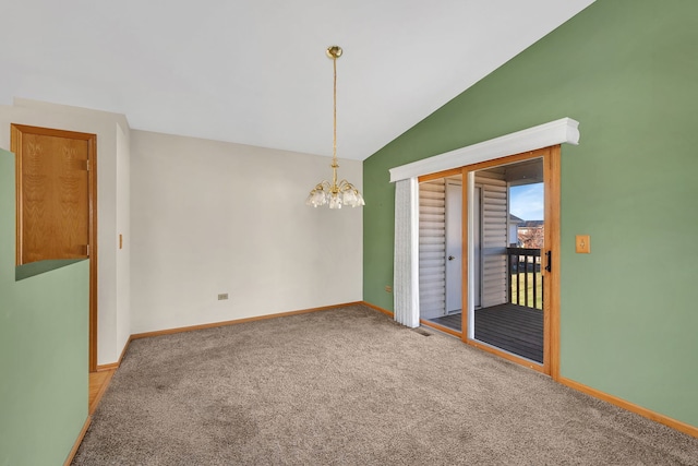 carpeted empty room featuring a notable chandelier and lofted ceiling