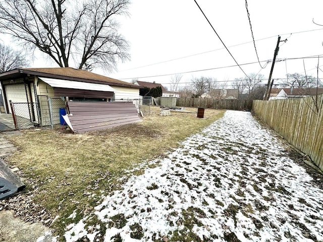 view of yard layered in snow