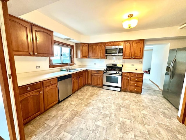 kitchen with sink and appliances with stainless steel finishes