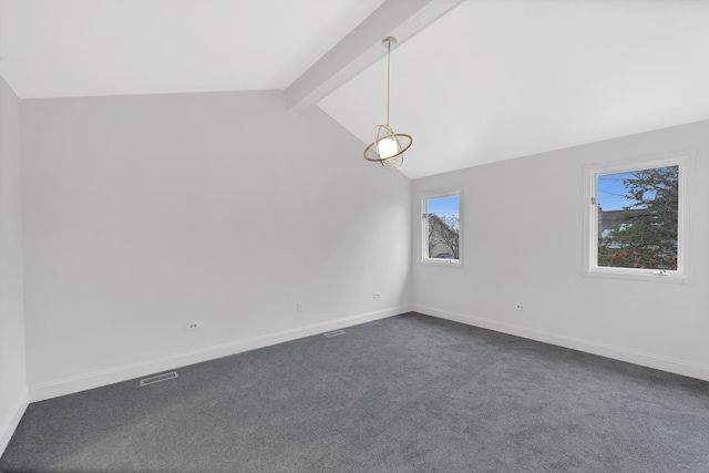 carpeted spare room with lofted ceiling with beams