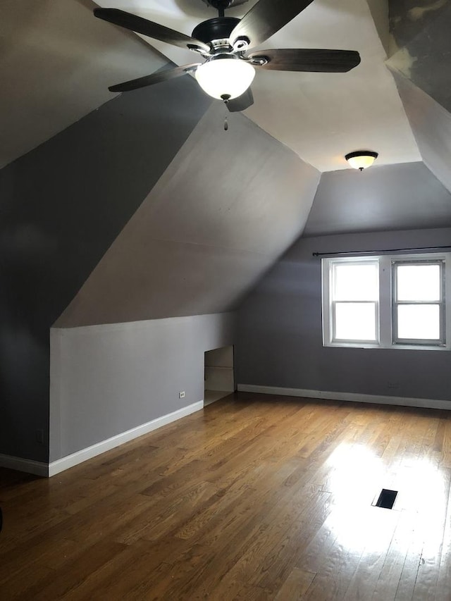 bonus room with hardwood / wood-style flooring, ceiling fan, and lofted ceiling