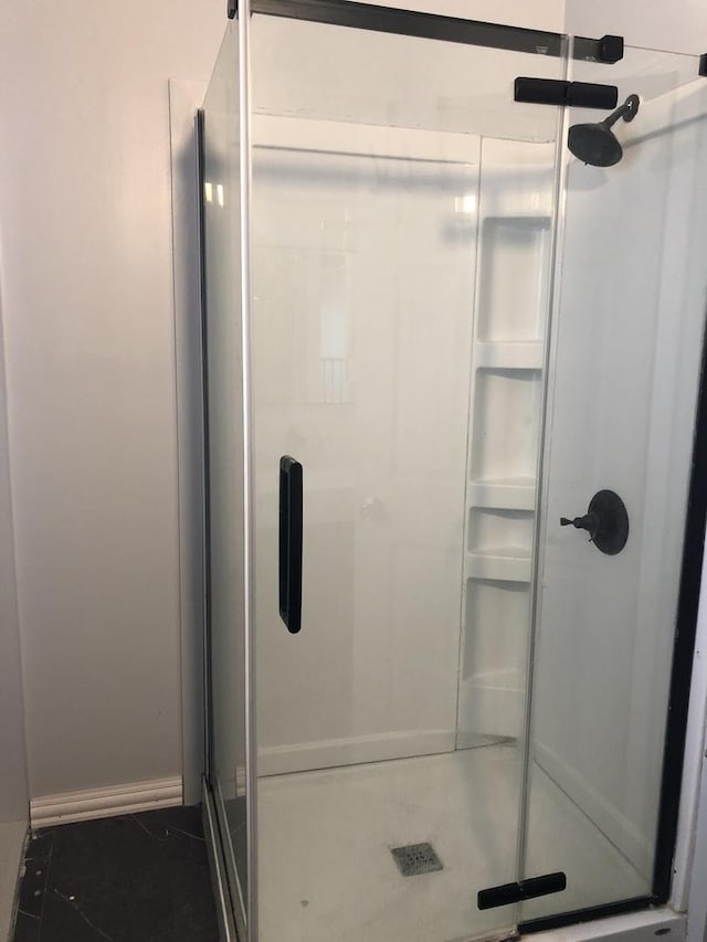 bathroom featuring tile patterned flooring and walk in shower