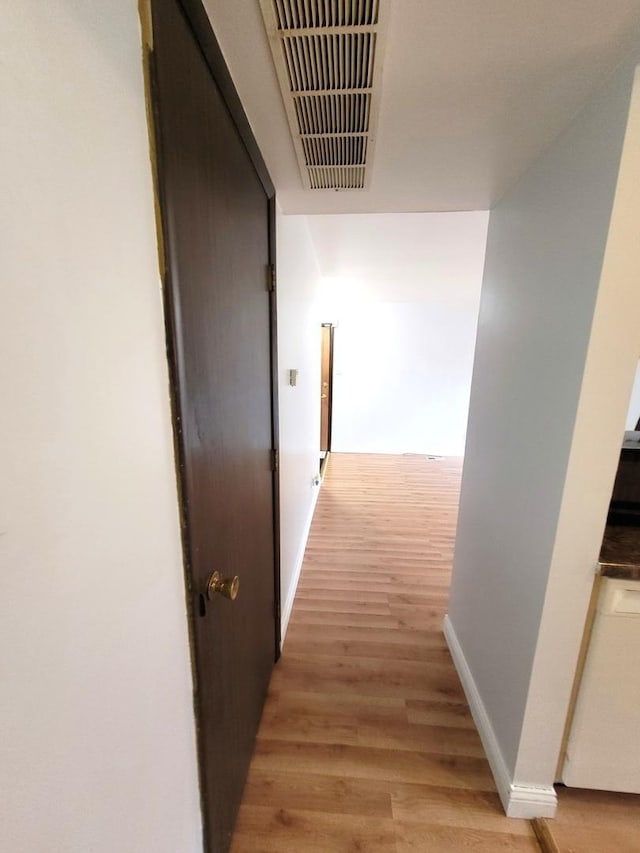 hallway featuring hardwood / wood-style floors