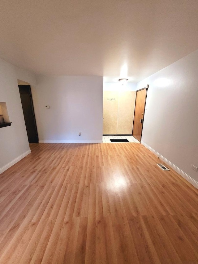 empty room with light wood-type flooring